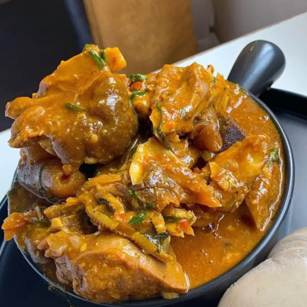 ogbonoSoup Ogbono Soup with beef, cow leg, fish, and kpomo – served with Eba, Fufu, or Wheat – Nigerian meal delivery